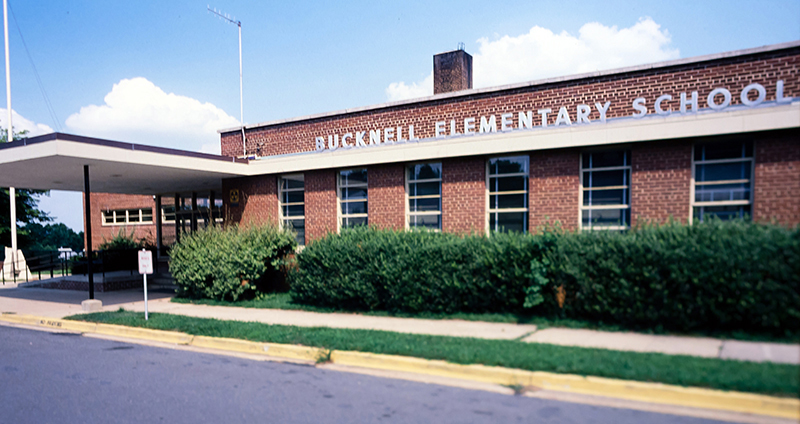 Color photograph of the main entrance to Bucknell Elementary School from a 35 millimeter slide. The picture is believed to have been taken in the late 1970s or early 1980s. 