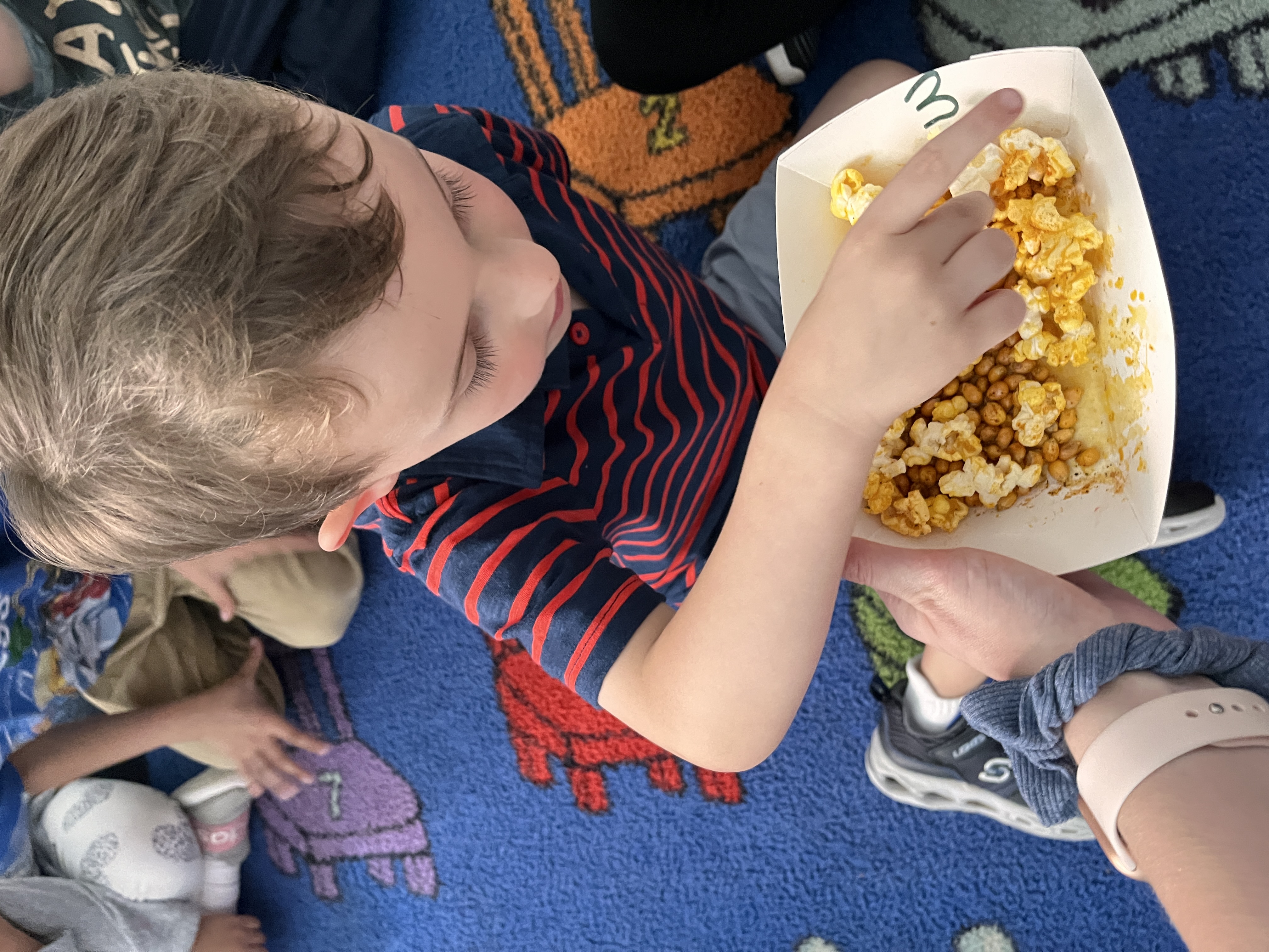 Students tasted and guessed the flavors of different kinds of popcorn to learn about their five senses. 