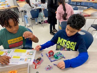 5th grade students get hands-on experience with electrical circuits. 